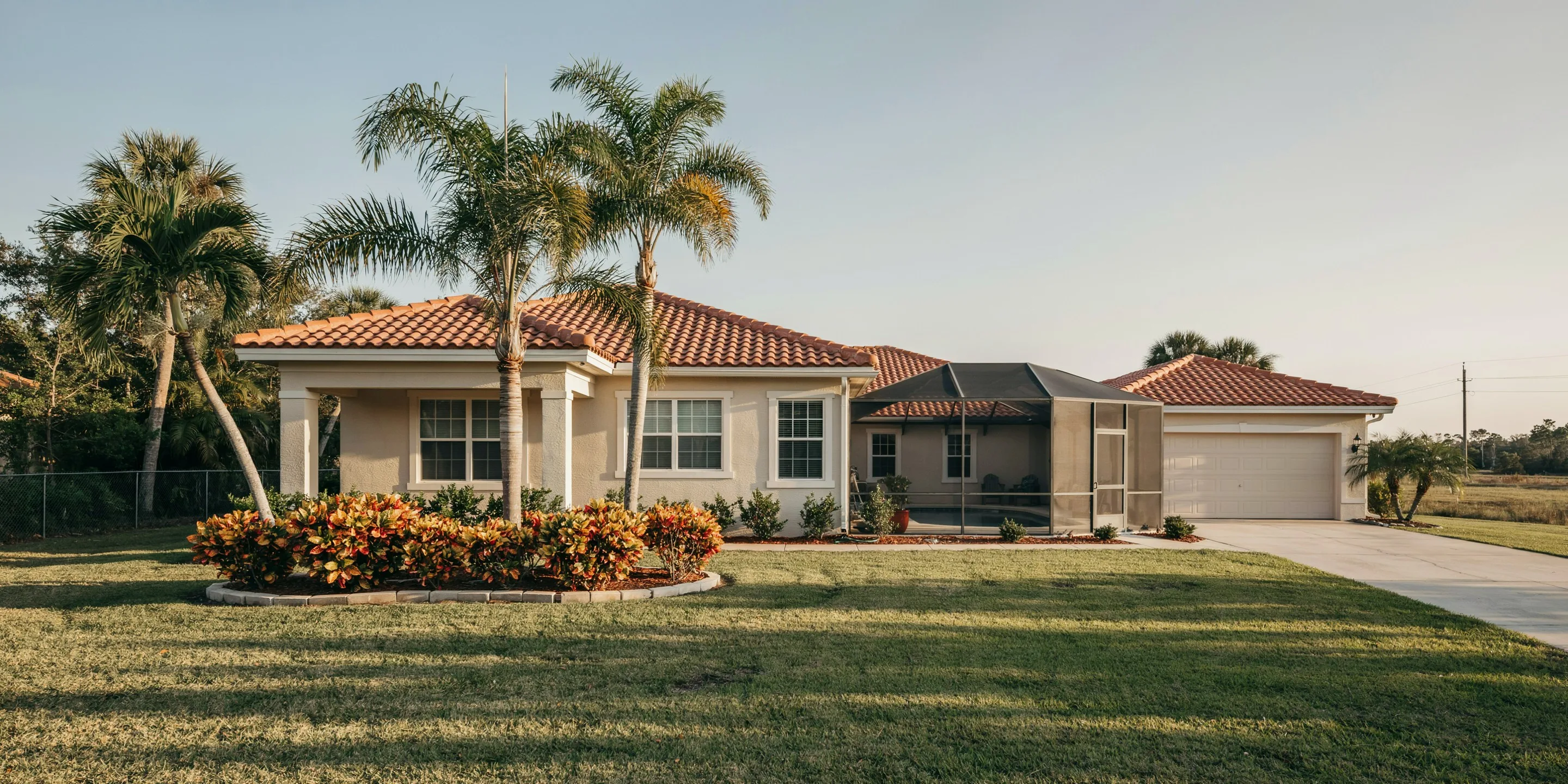 Tile-roof ranch home with screened lanai in Venice, FL